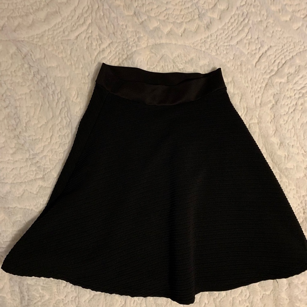 Black skirt above knee
